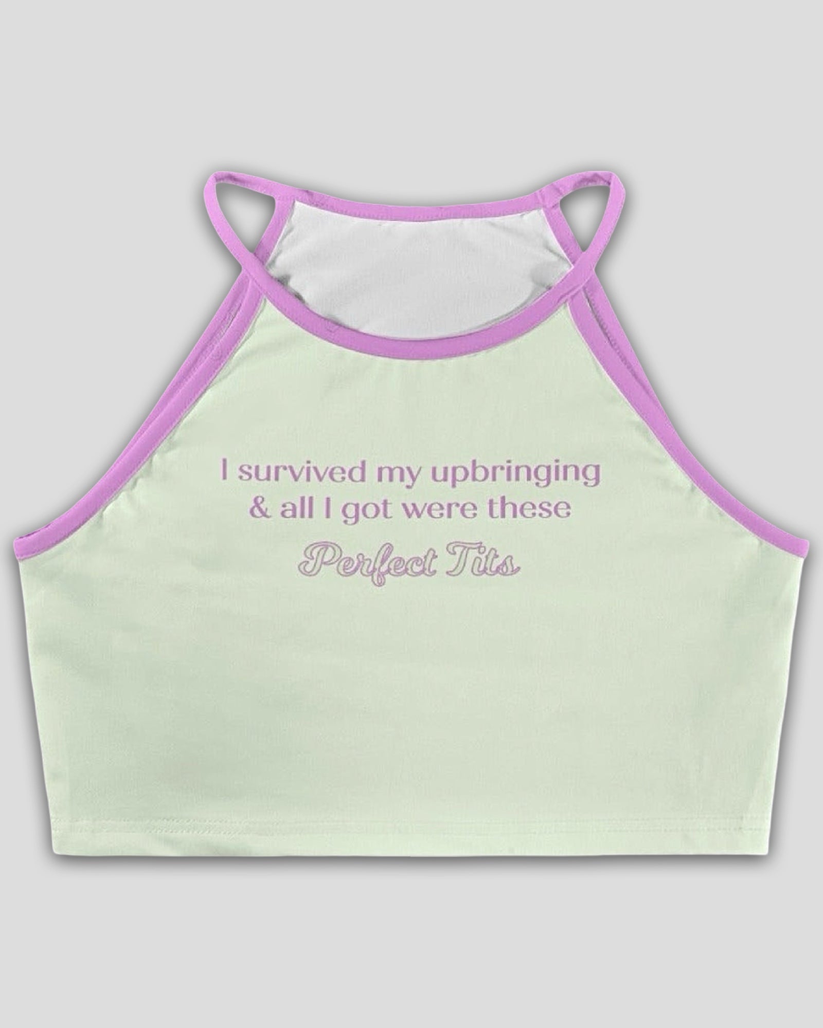 light green crop halter top with baby pink trim featuring a text graphic that reads