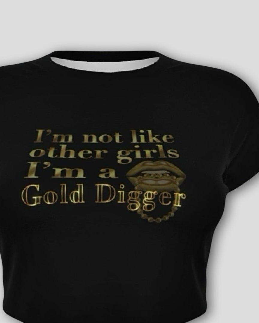 front view of a black cropped baby tee with gold text that reads