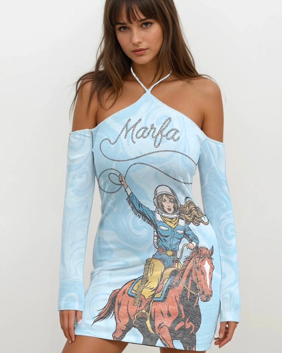 half body photo of a Woman wearing a blue long sleeve halter dress with Marfa text and a cowgirl graphic on a white background