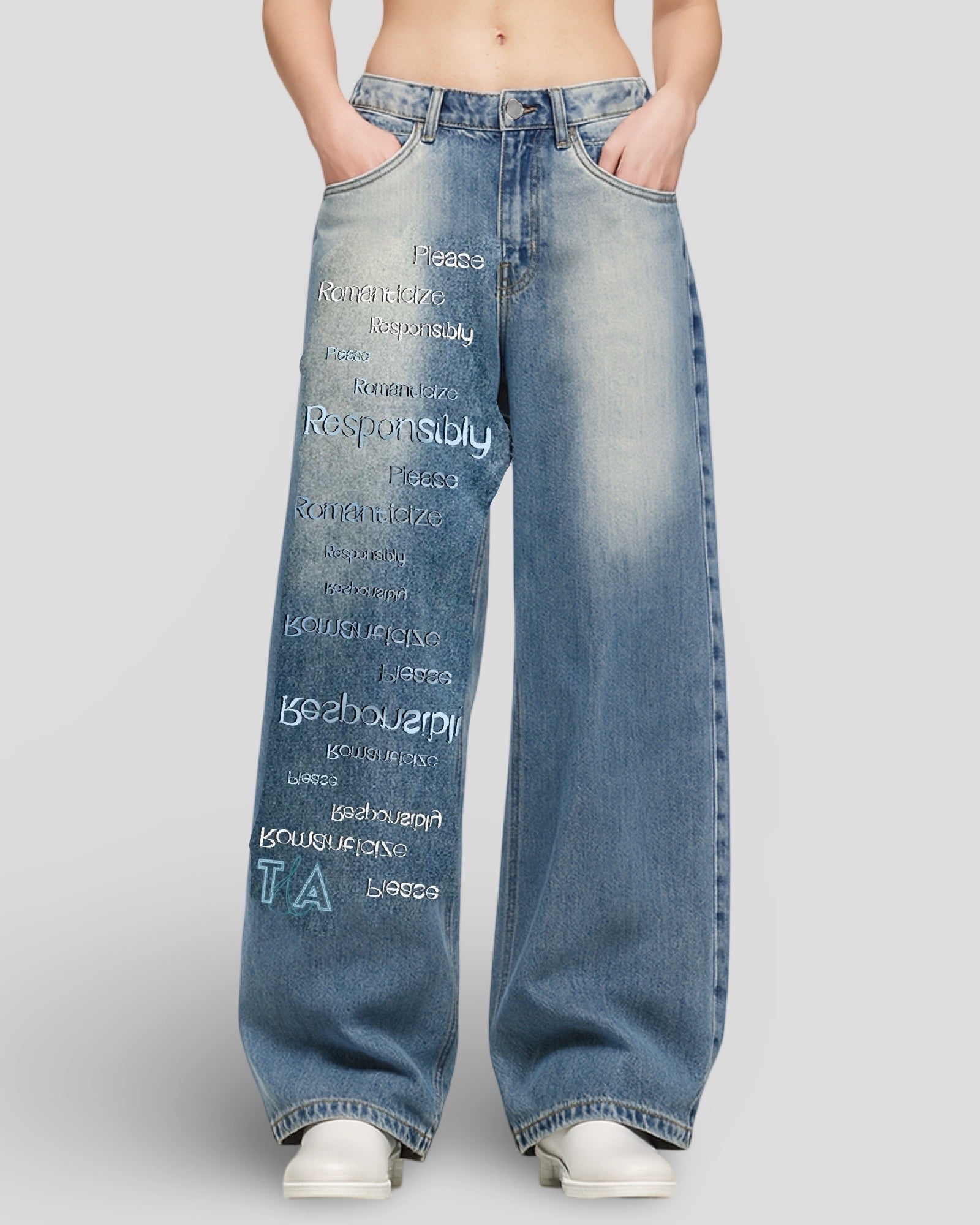on-model image of wide leg mid rise unisex light blue vintage washed denim jeans with
