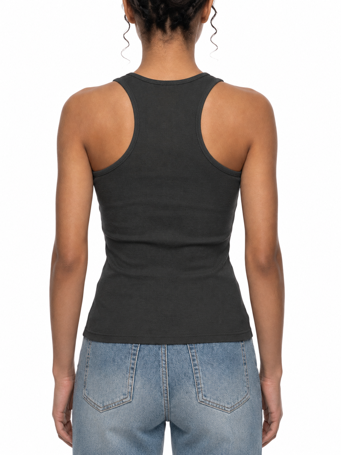 Person wearing a black tank top and blue jeans on a white background