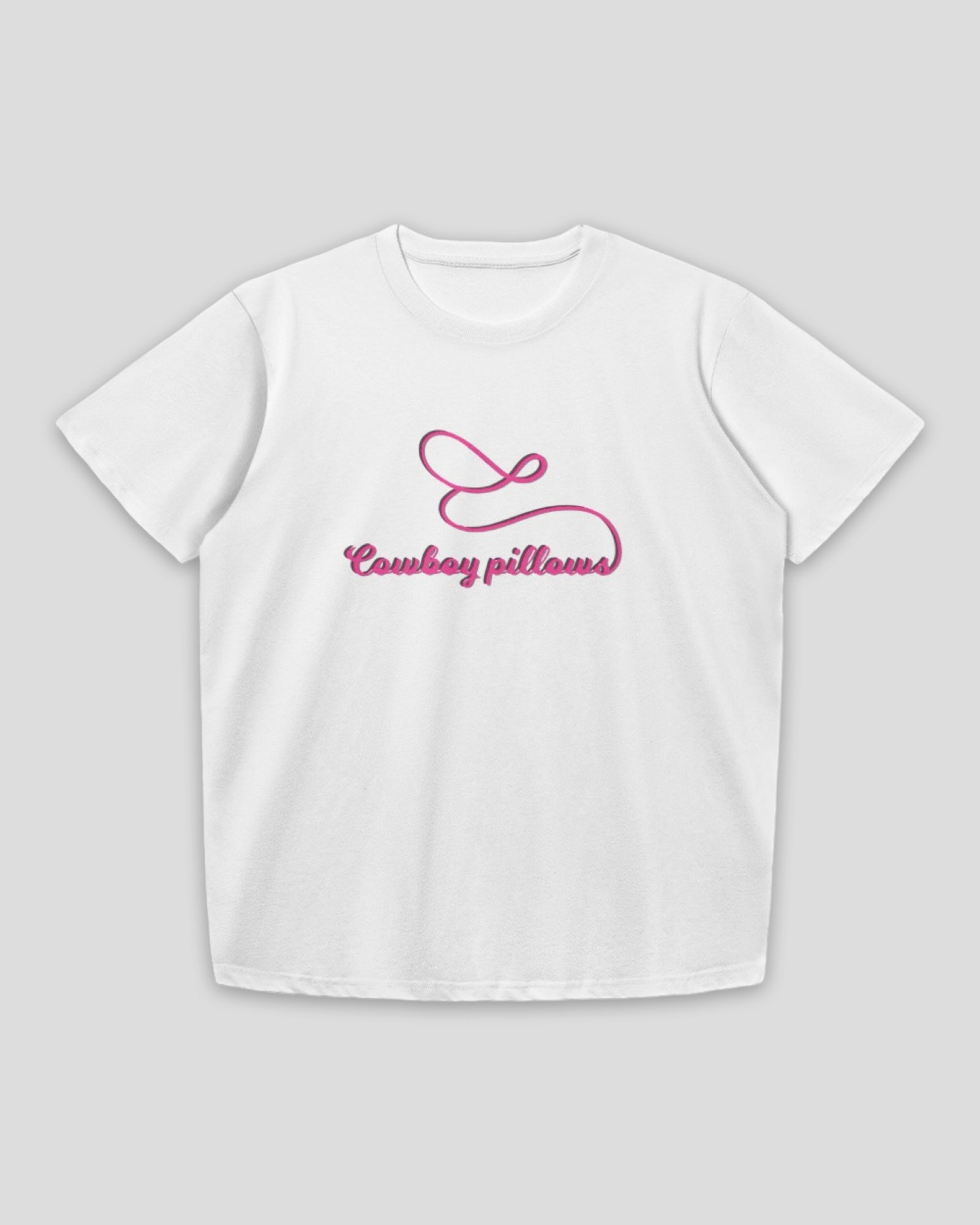 flat lay of a white cropped fitted crew neck cotton baby tee with embroidered pink text that reads Cowboy Pillows against a white background