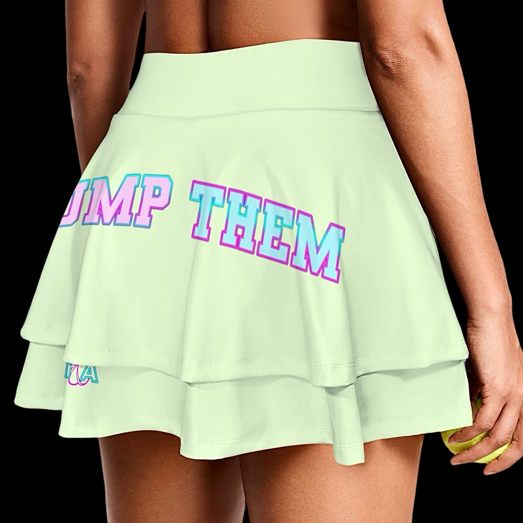 model wearing a light green ruffle sports skort with 