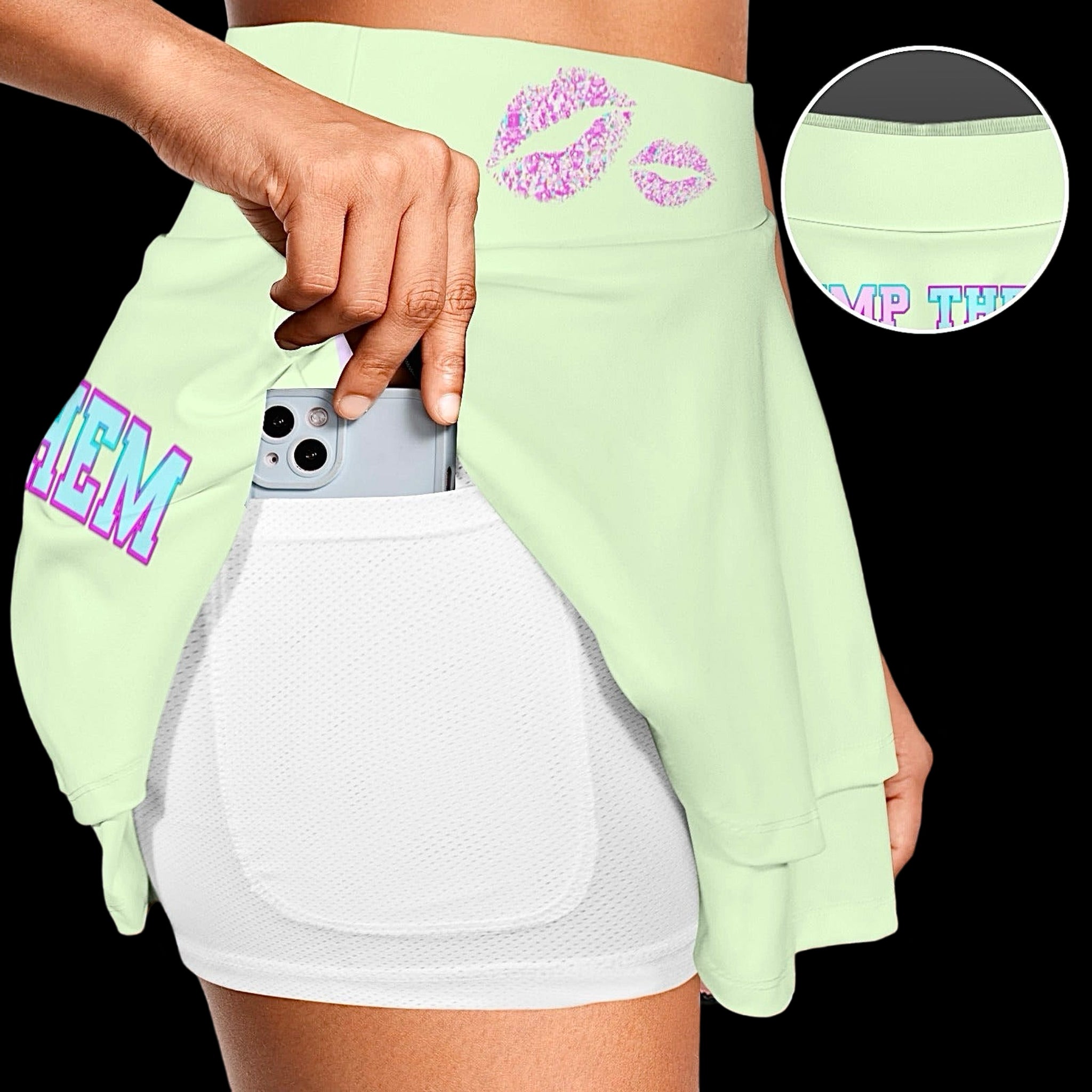 model wearing a light green ruffle sports skort with text print 