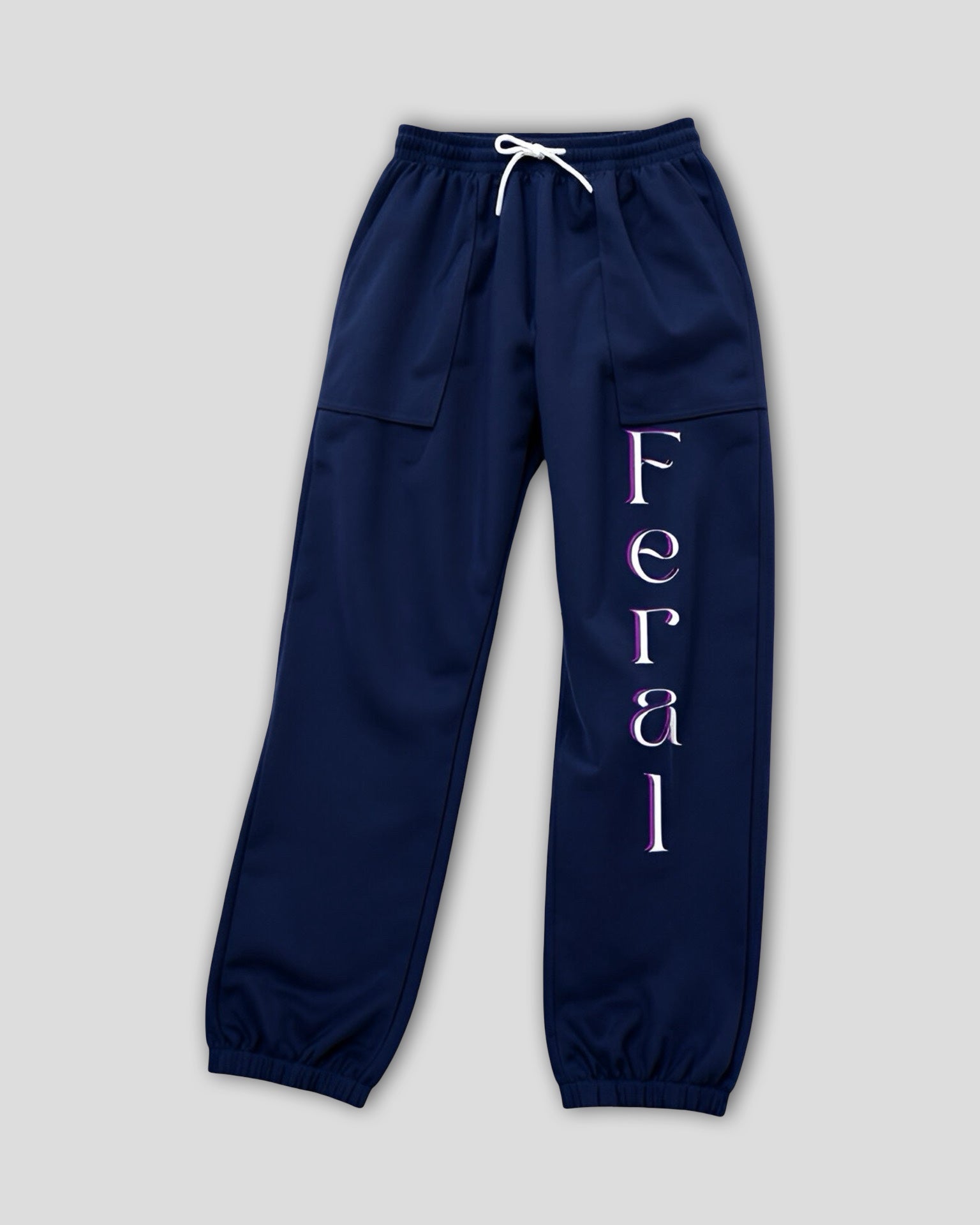 Navy blue sweatpants with 'Feral' text on a light gray background