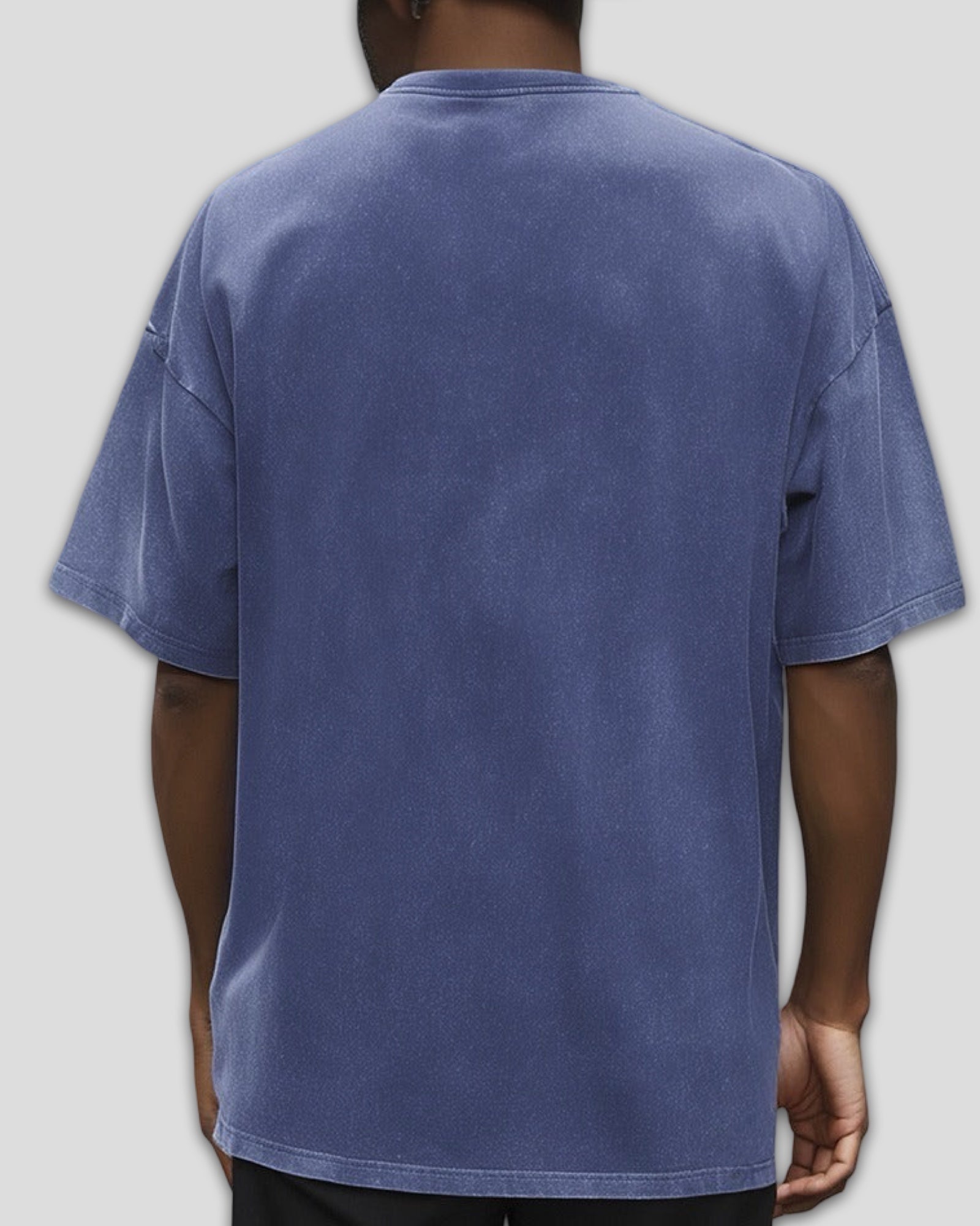 Blue heavyweight cotton t-shirt worn by a person on a plain background