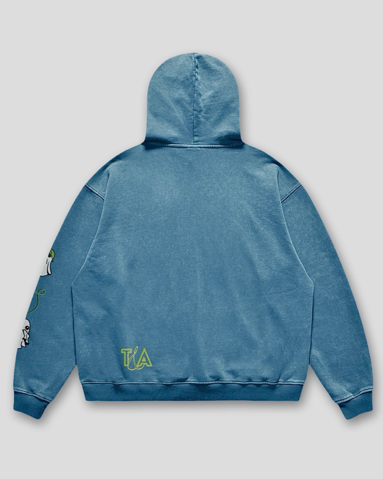 back view of a flat lay image of a washed heavyweight cotton oversized hoodie with a kangaroo pocked and embroidered original ghost graphics on the front and left arm and a small T&A logo against a white background