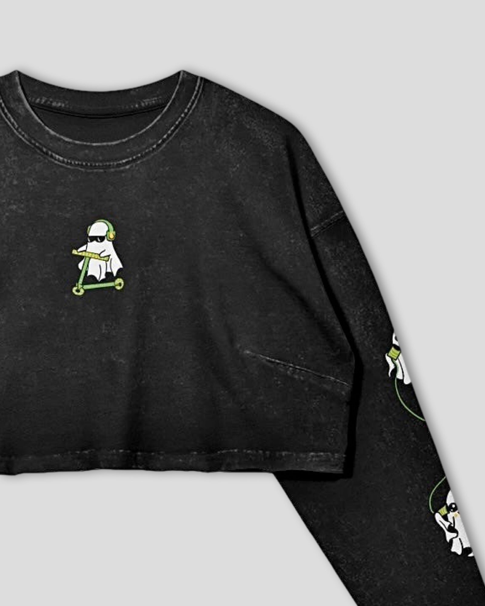Black long-sleeve shirt with a small ghost graphic on a light gray background