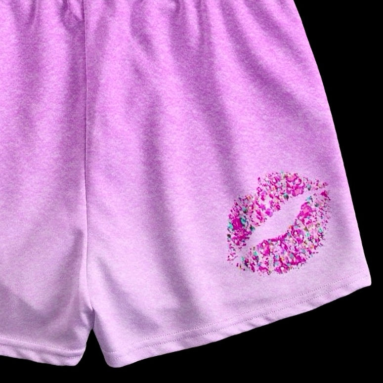 close up shot of kiss mark print on pink ombre lovergirl shorts with drawstring 