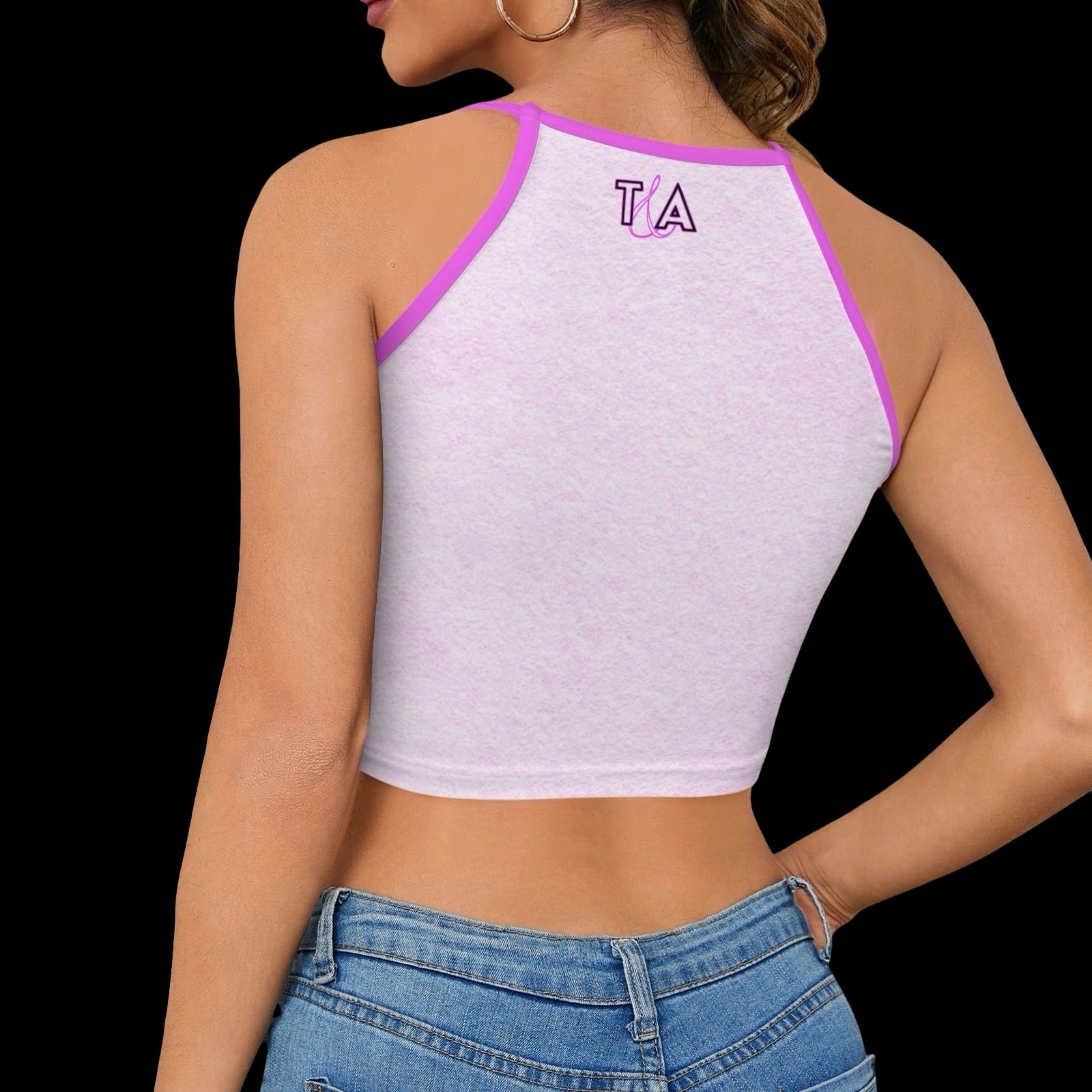 back view of a woman wearing a light pink halter crop top with contrast trim and a small T&A logo against a plain background