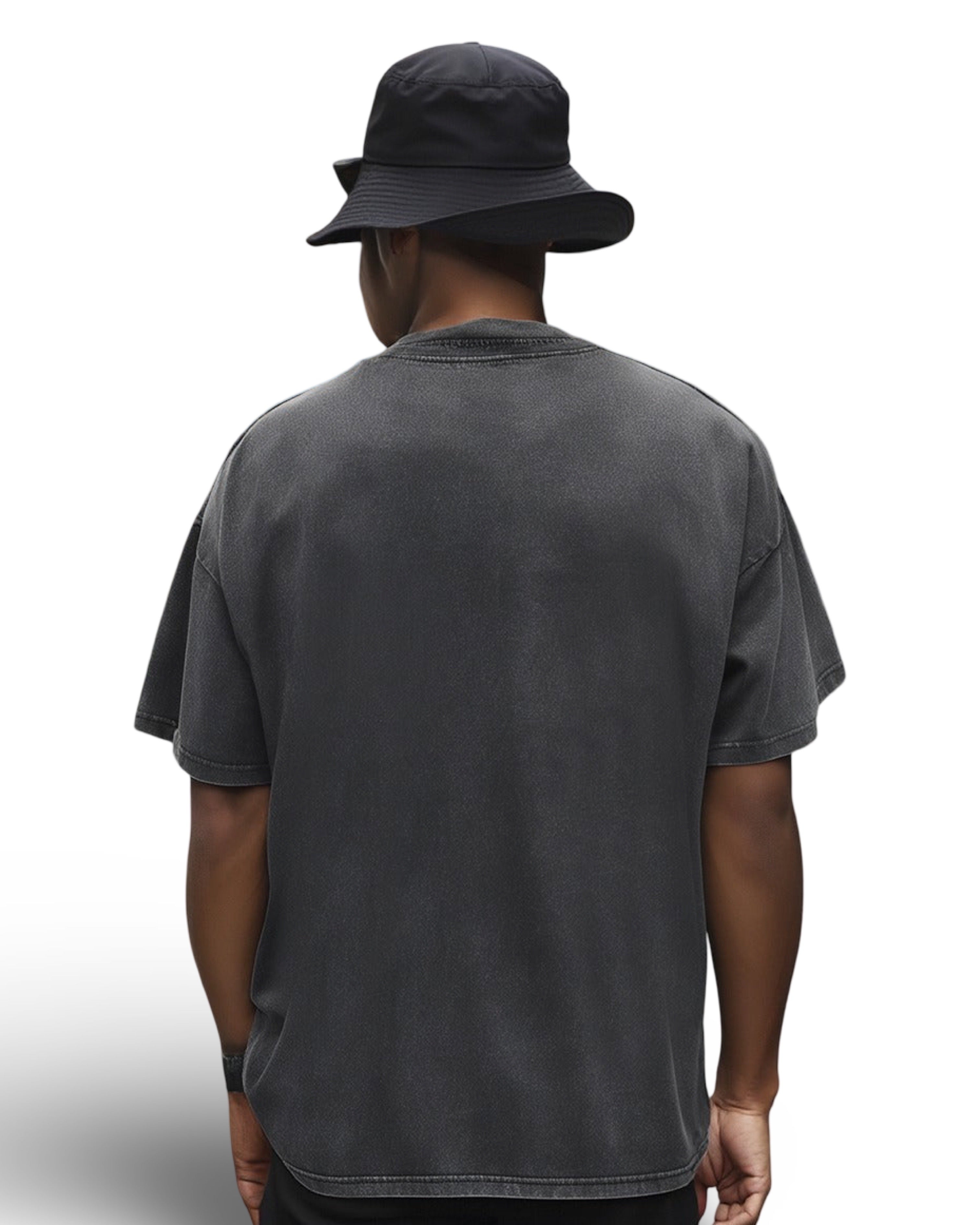 Person wearing faded black heavyweight cotton t-shirt and black bucket hat on a white background