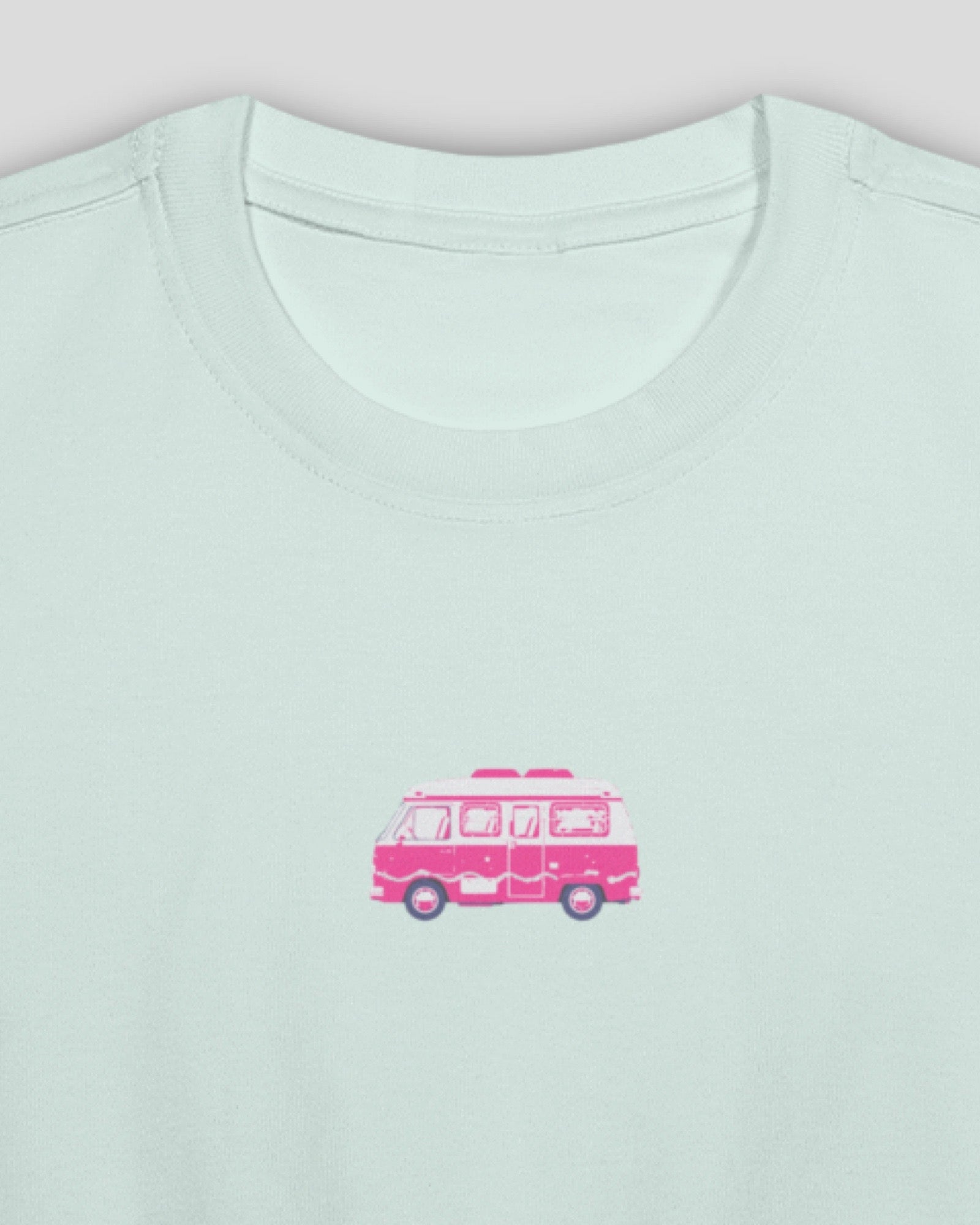 detail shot of a light blue crop cotton baby tee with an embroidered design of a pink camper van against a white background