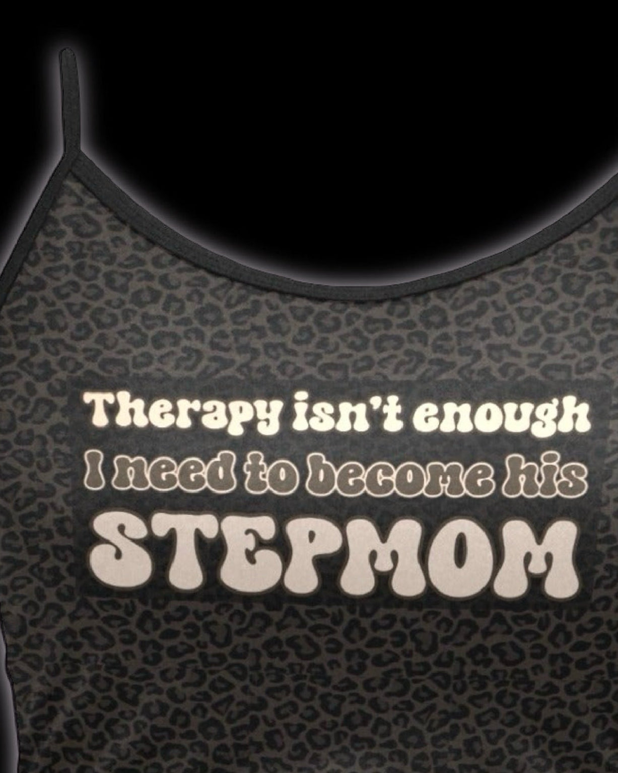 dark brown leopard print spaghetti strap cami crop top with text graphic that reads 