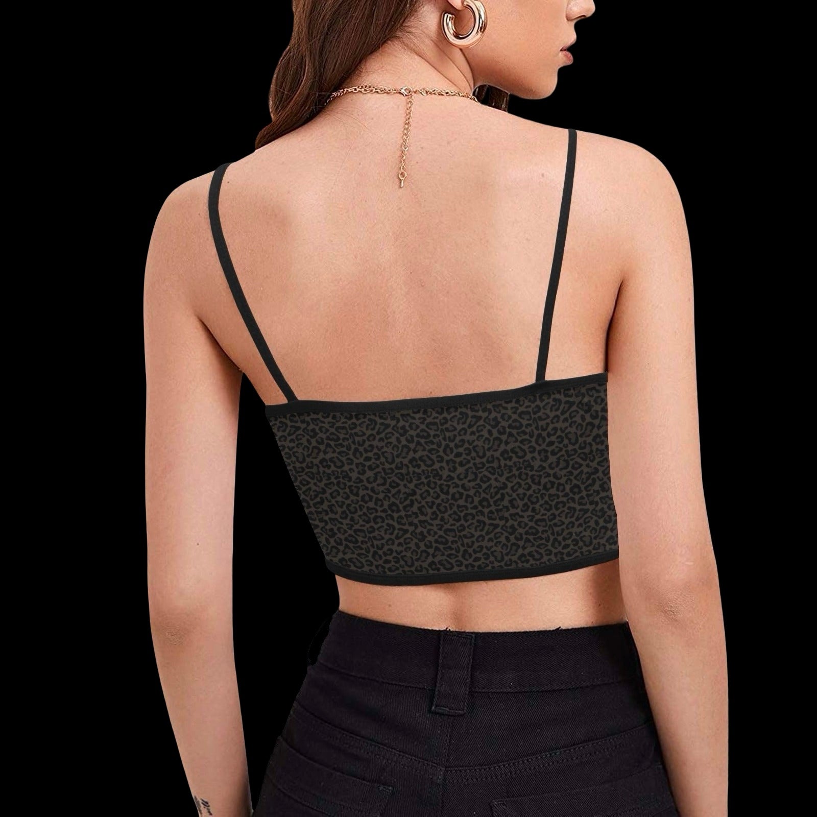 back view of woman wearing dark brown leopard print spaghetti strap cami crop top with text graphic that reads 